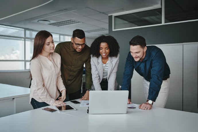 ey smiling multiethnic coworkers working together in office.jpg.rendition.690.460