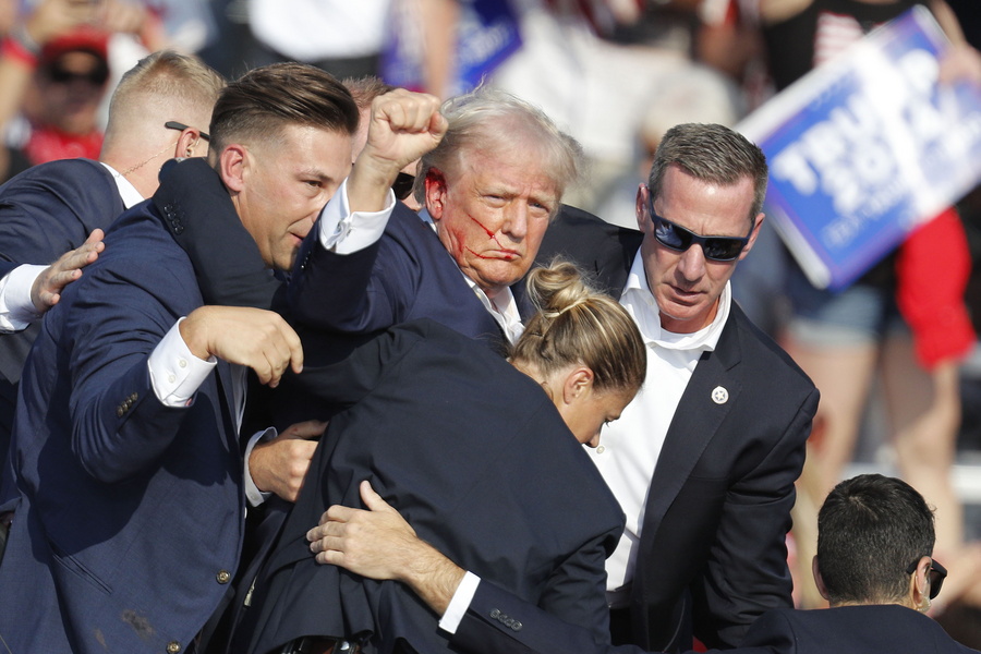 former us president donald trump rushed off stage after incident at campaign rally