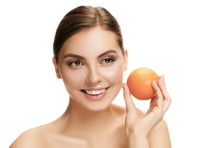 portrait attractive caucasian smiling holding orange woman isolated white 155003 35003